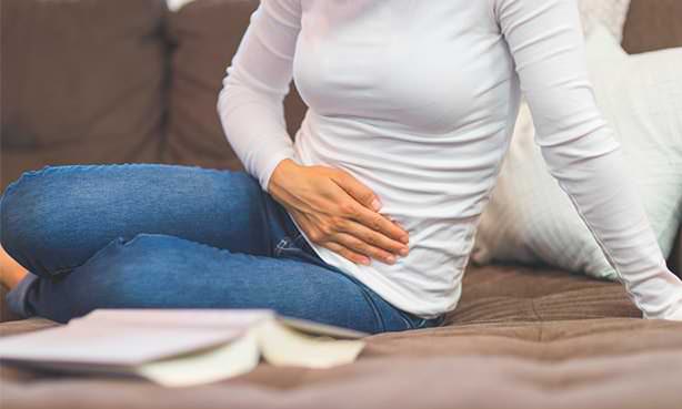 Боль внизу живота у женщины